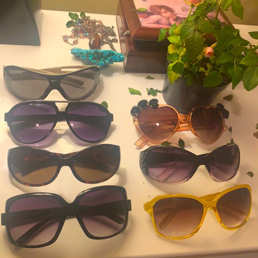 7 Like new sunglasses $5 each or buy them all for $20